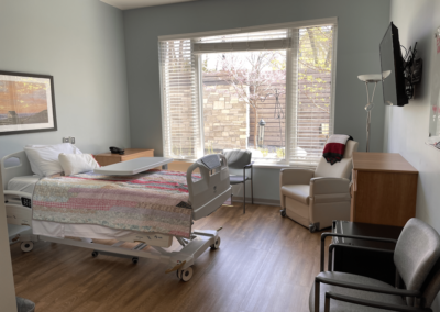 Hospice bedroom with large garden window