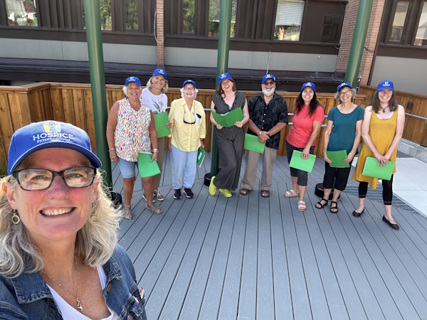 Group of Hospice volunteers standing on deck