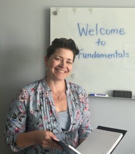 Woman in front of a white board